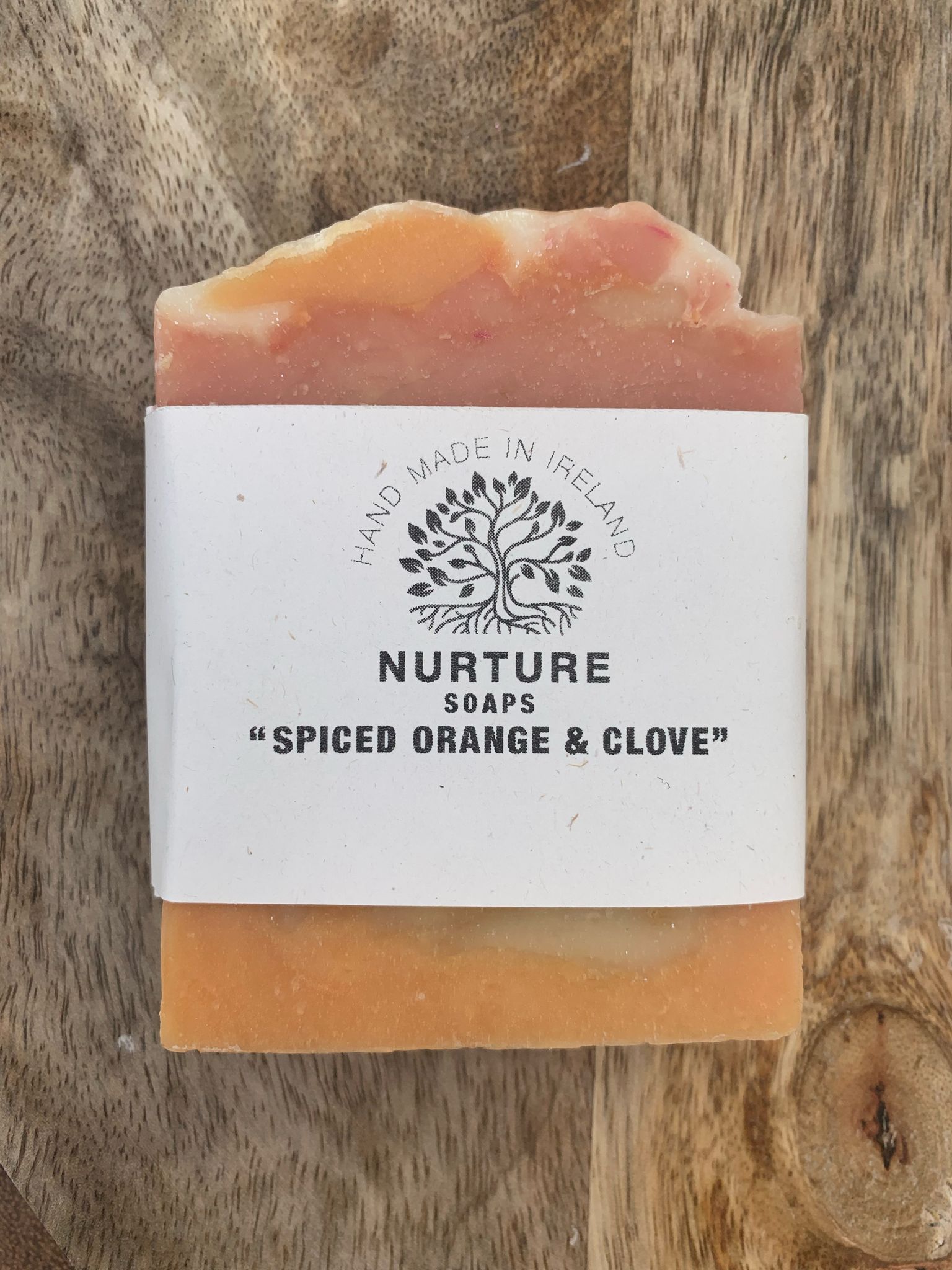 A bar of natural handcrafted soaps. Nurture soaps spiced orange and clove variety.